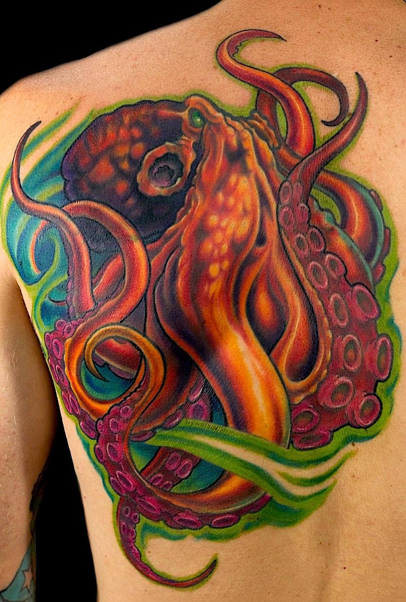 Orange and purple octopus tattoo surrounded by bright green waves