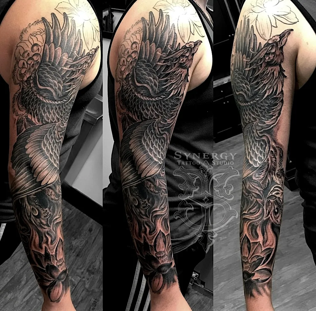 Black and grey Japanese-style sleeve with a large bird and flowing ornamental details