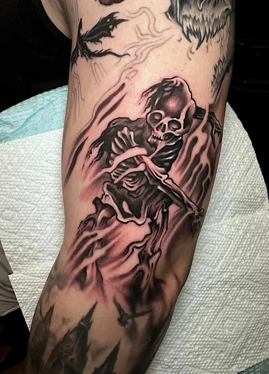Black and grey skeleton tattoo against a dark forest background