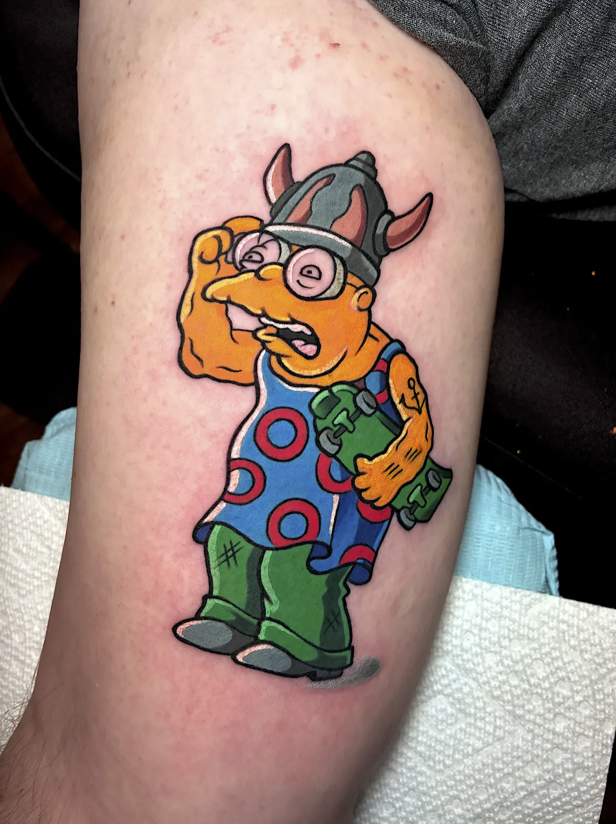 Color Ralph Wiggum tattoo dressed in a Viking helmet