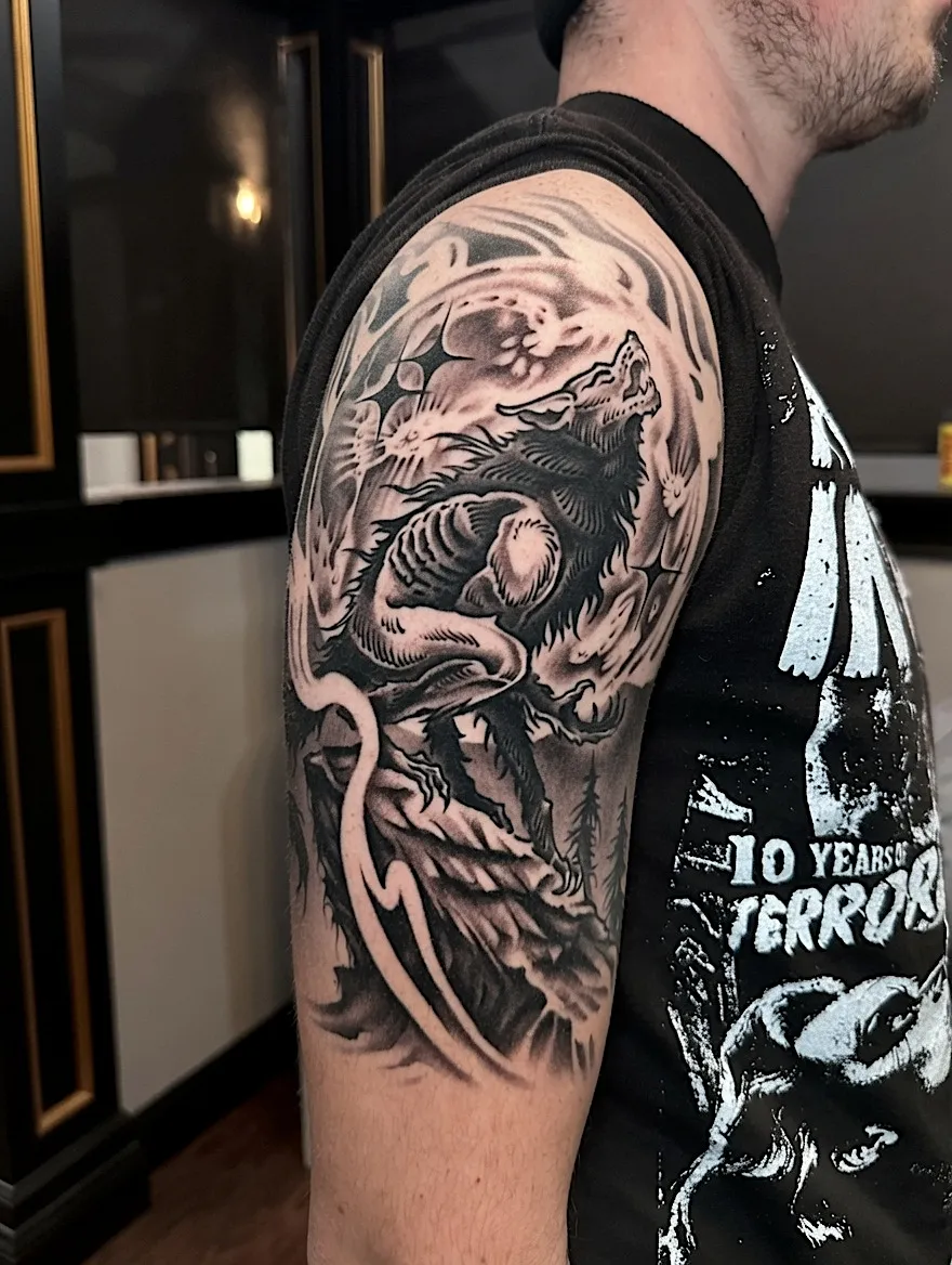Black and grey skeletal warrior portrait tattoo across the shoulder