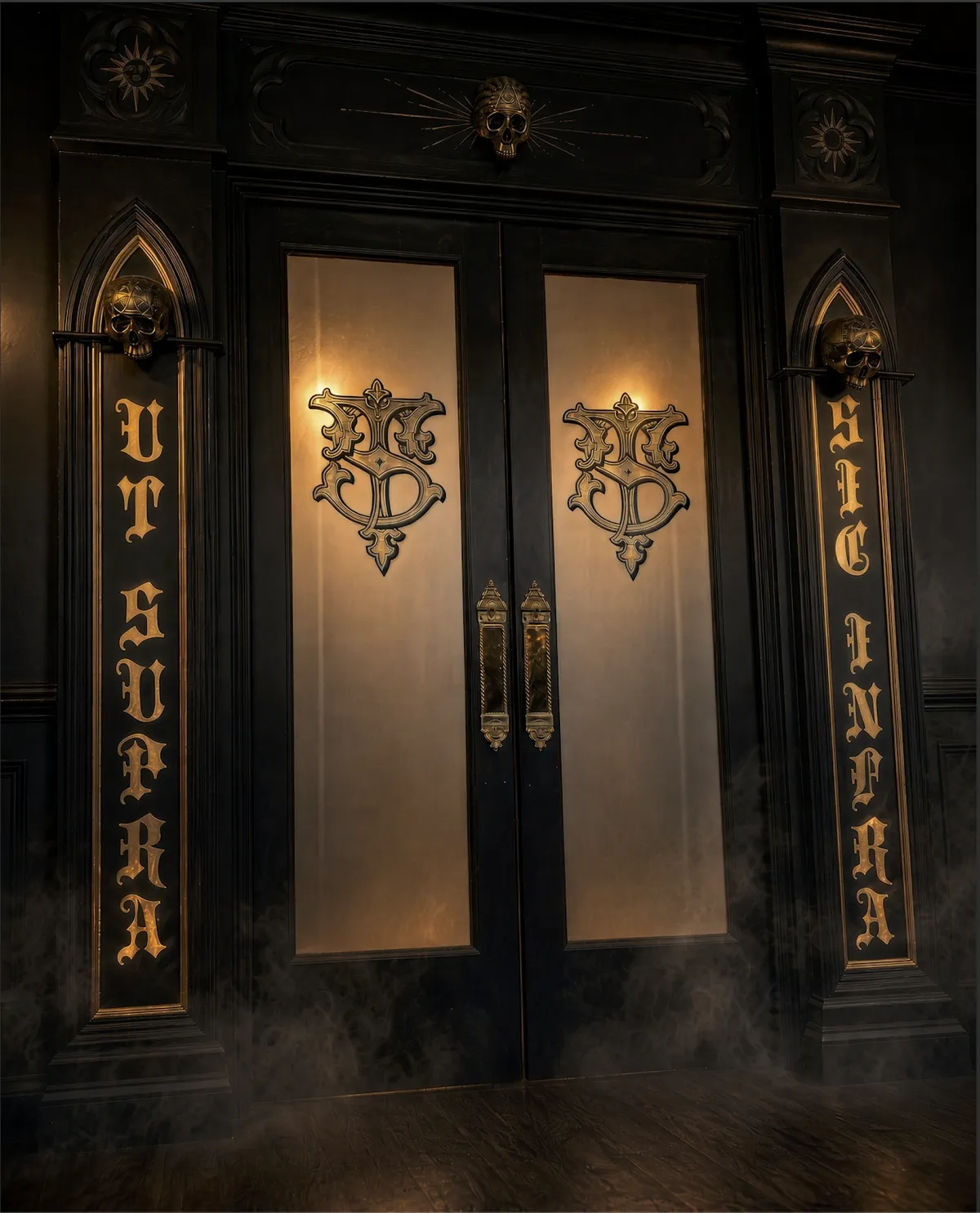 Black and gold double doors with Synergy Tattoo Studio monograms and skull details
