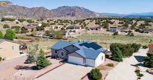 Best Tesla Solar installation with panels and Powerwall on family home in South Jordan Utah showing 30% instant rebate savings from Ask Solar Mike, Utah’s leading Tesla-certified installer for full solar systems