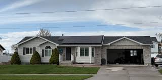 Tesla Powerwall battery system installed on a family home in American Fork Utah with 30% instant rebate savings graphic by Ask Solar Mike Tesla-certified installers