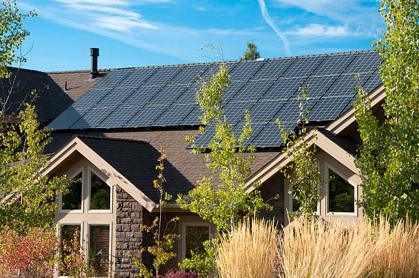 Sleek black 2026 Tesla Solar Panels on an exclusive Bountiful estate with sweeping valley and mountain views