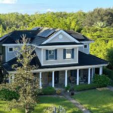 Sleek black 2026 Tesla Solar Panels elegantly installed on a premium Sandy luxury home with modern architecture and breathtaking mountain views