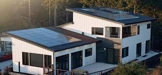 Premium Tesla Solar Roof with sleek black tiles achieving solar luxury on a sophisticated Lehi home featuring elegant modern architecture and panoramic Wasatch Mountain views