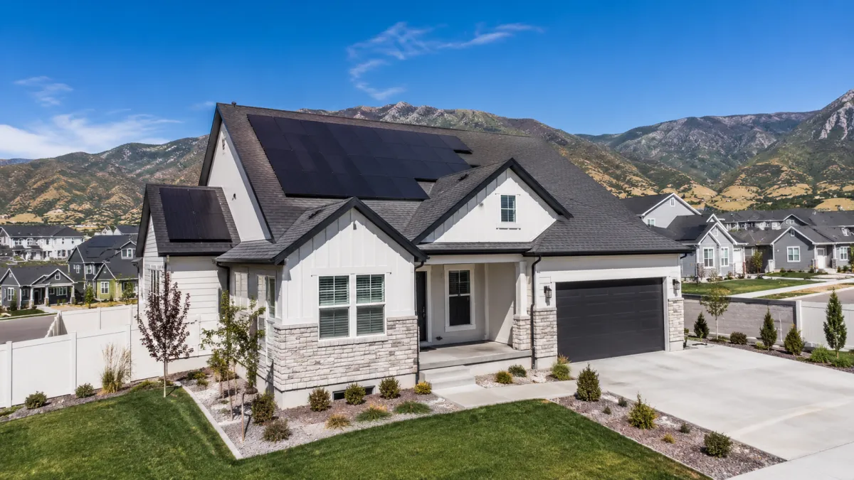 Tesla solar panels and a Tesla Solar Roof compared on two Utah homes