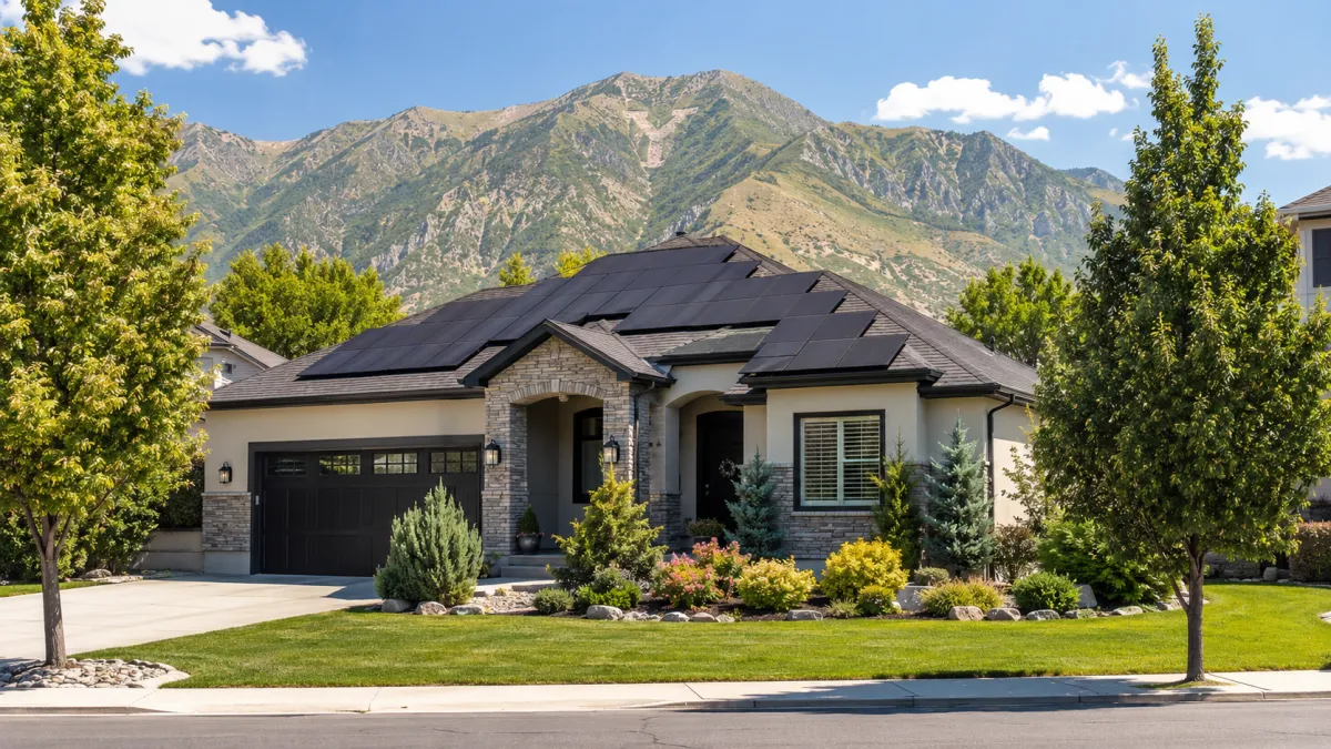 Tesla Solar Roof installed on a modern Salt Lake City home against a blue Utah sky