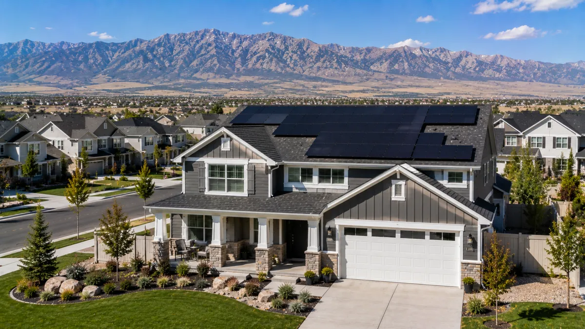 Tesla solar on a newer Riverton home with the Oquirrh Mountains