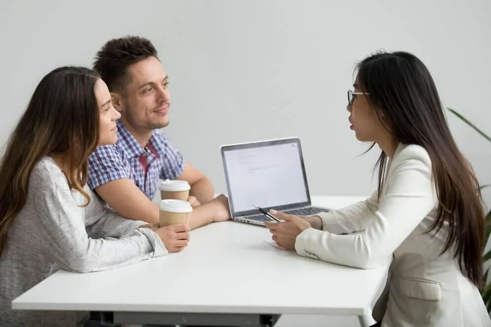Agent talking to couples about the coverage of the plan