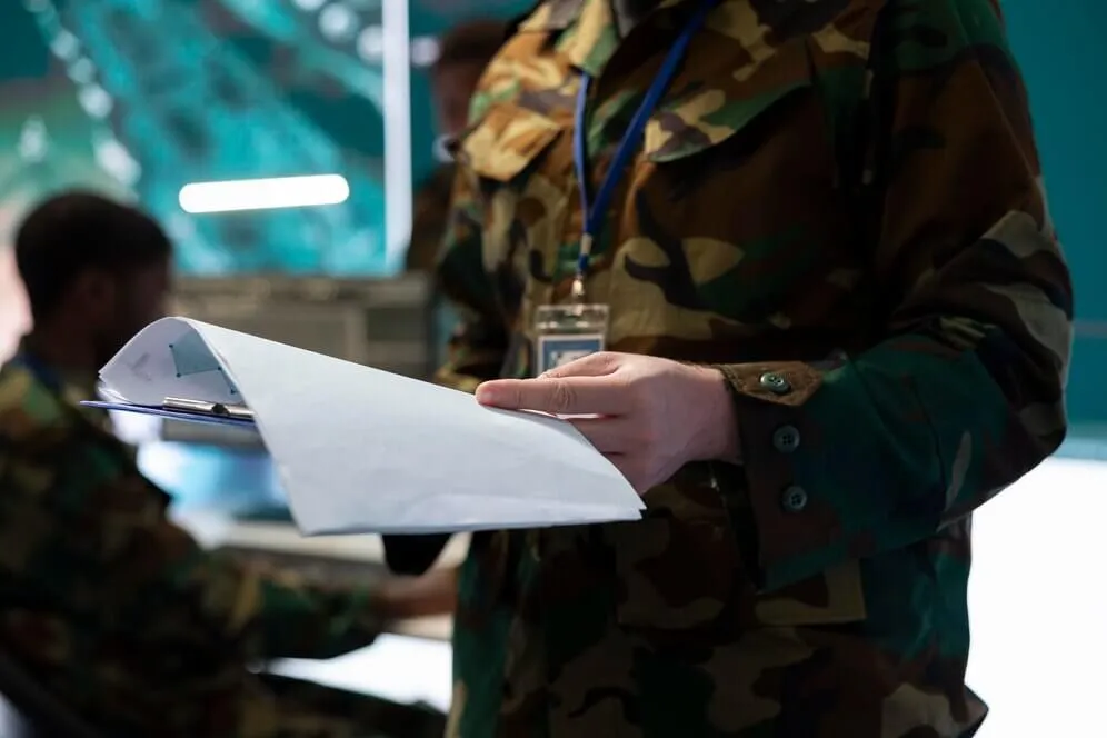 Military man reading about the Medicare options he have
