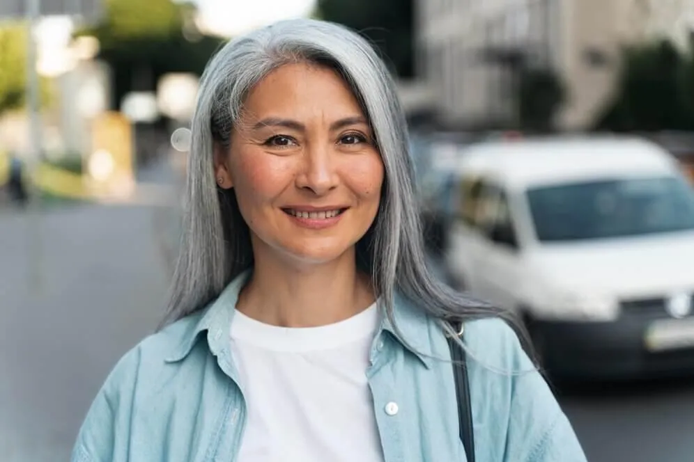 Happy old woman in the street