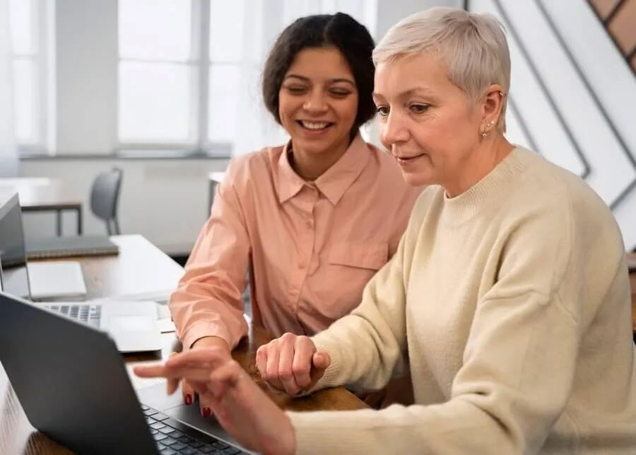 Agent assisting old woman on medicare