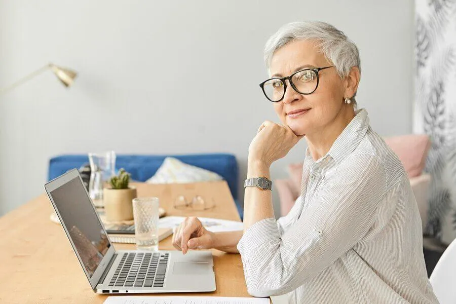 Confident old woman working