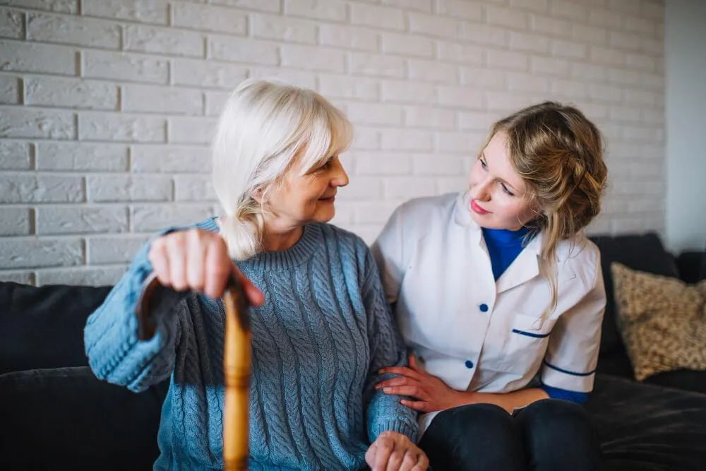 Woman assisting the aged