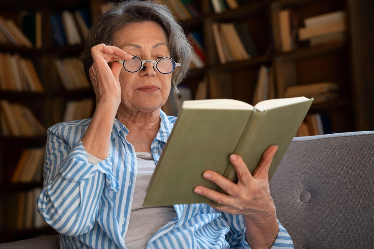 Old woman checking the resources for Medicare