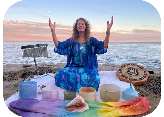 Michele Newman of High Vibe Life near beach in Santa Cruz with crystal bowls and other sacred resonance tools with the full moon