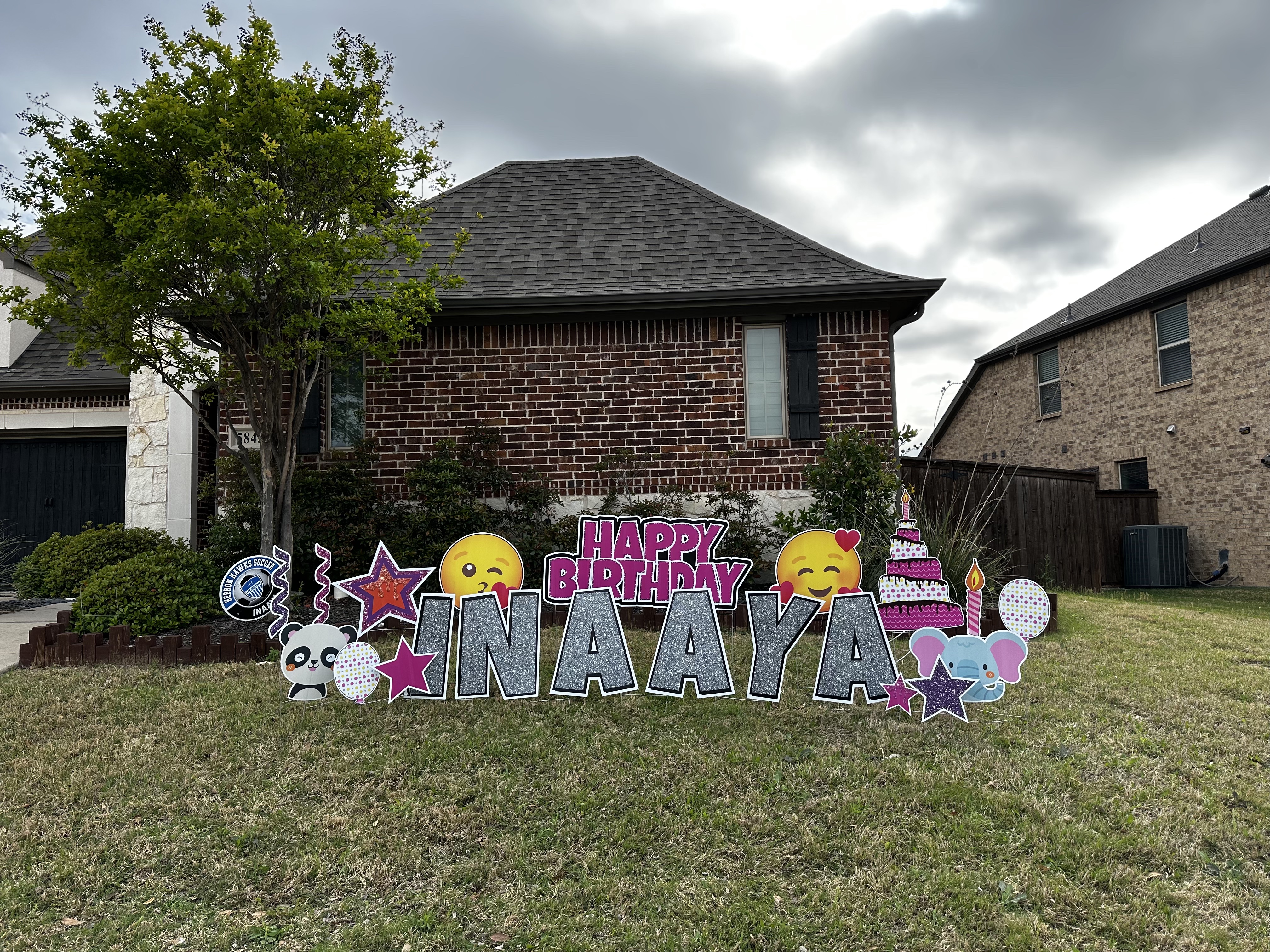 Yard Greetings birthday display with colorful letters and graphics