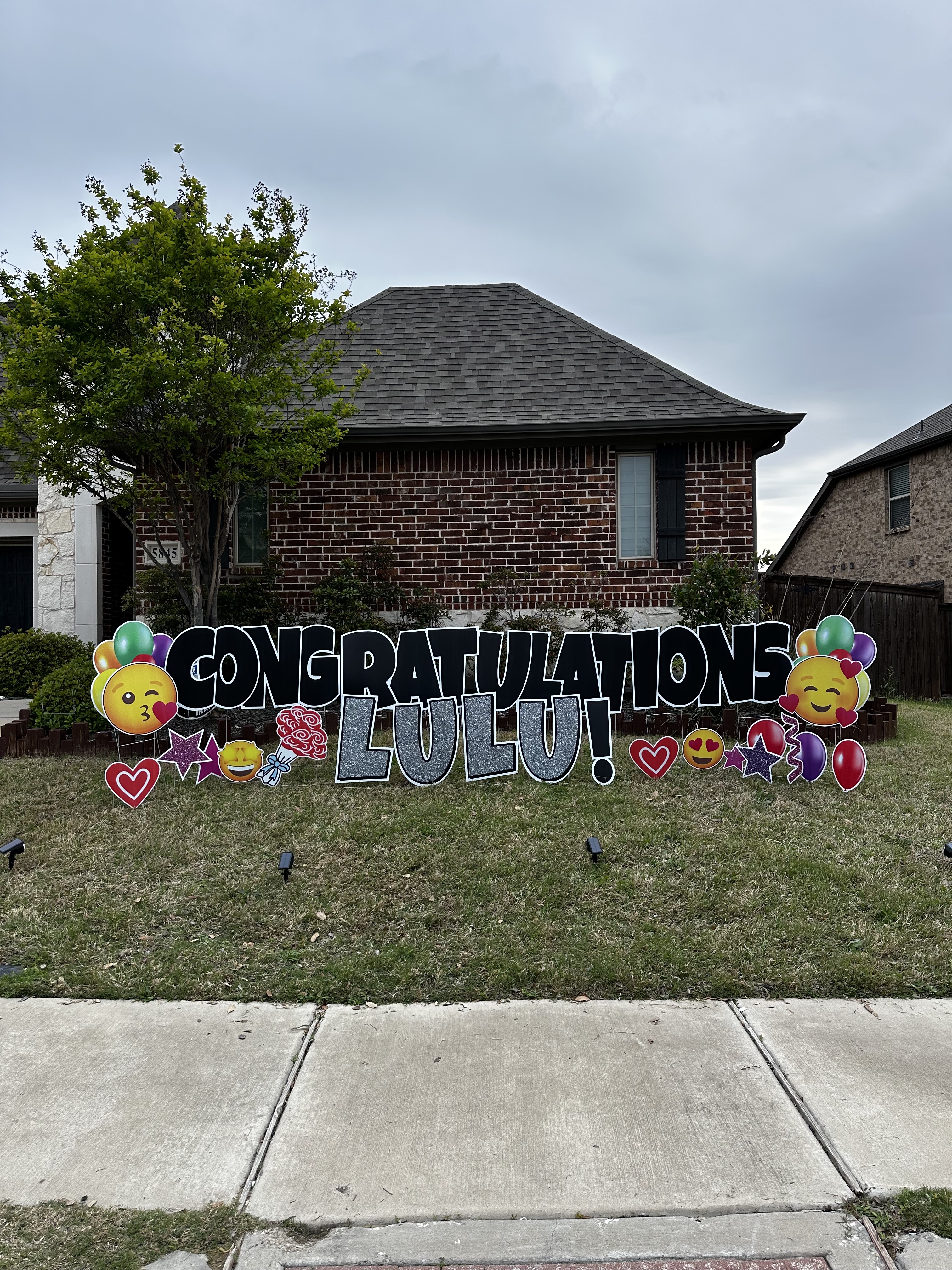 Custom Yard Greetings display set up in a front yard