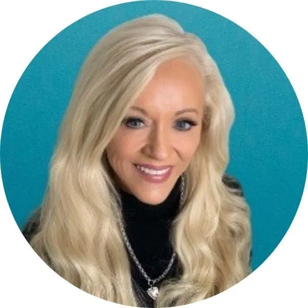 Smiling client with long blonde hair.