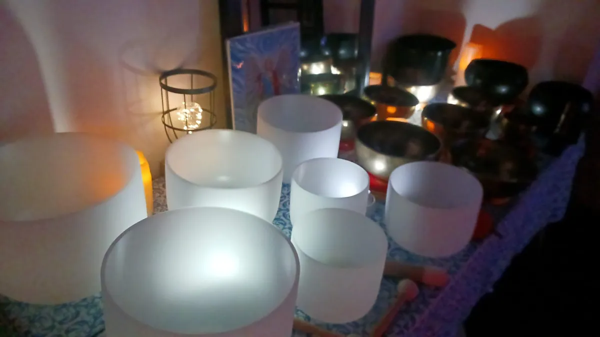 Various sound healing instruments arranged for a sound bath session.