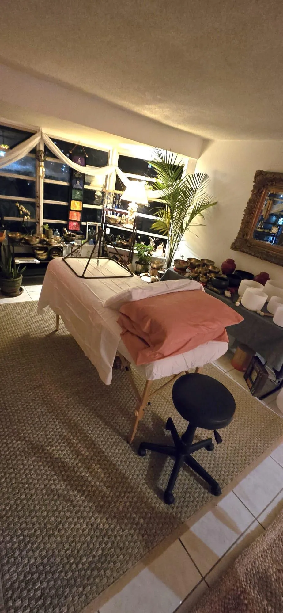 Sound healing studio table and instruments in a serene environment for a group or private sessions