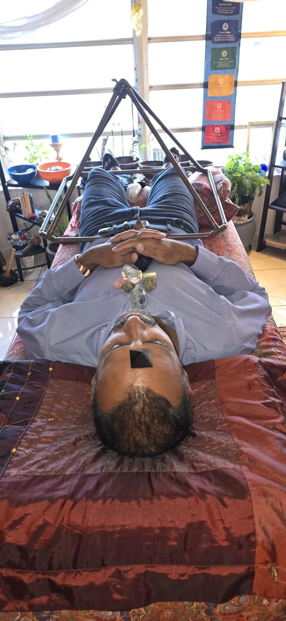 Individual in a serene setting receiving reiki and access bar and crystal healing