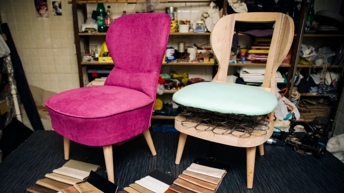 Chair in a workshop being upholstered.