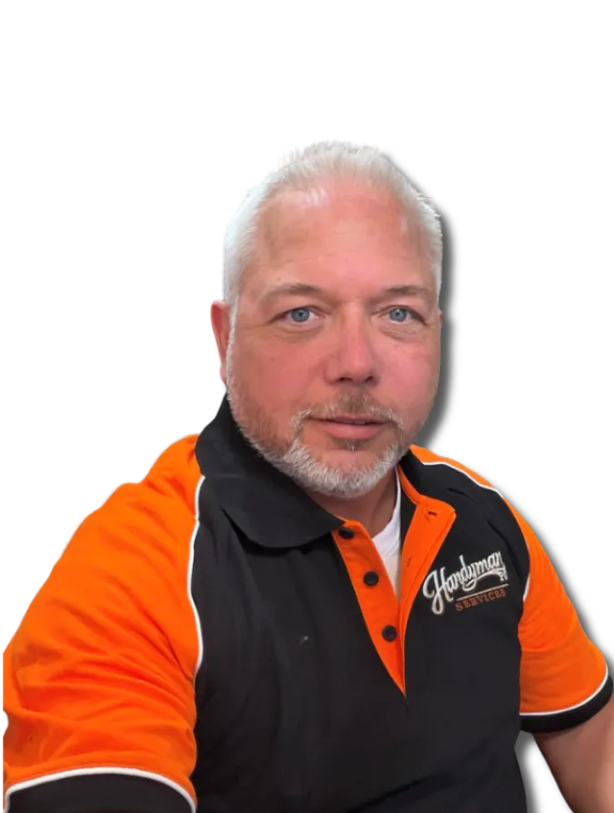 Author standing in a workshop wearing a work shirt