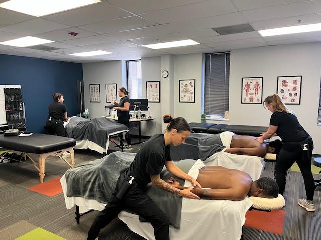 classmates giving massages