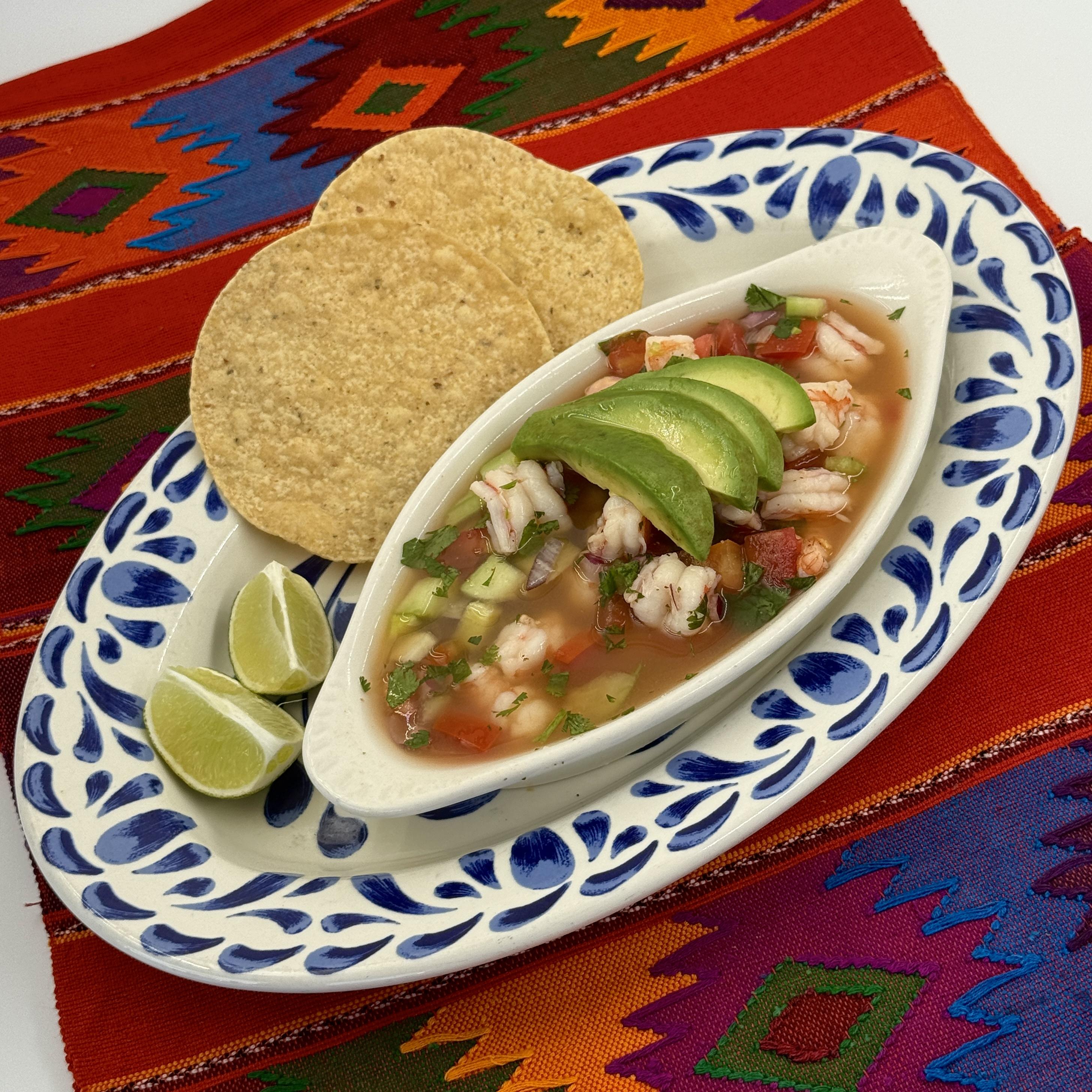 Ceviche-Citrus-marinated wild-caught shrimp served with fresh tomatoes, cilantro, onions, crisp cucumbers, and creamy avocado, with a hint of serranos for a fiery bite. Served with crunchy corn tostadas.