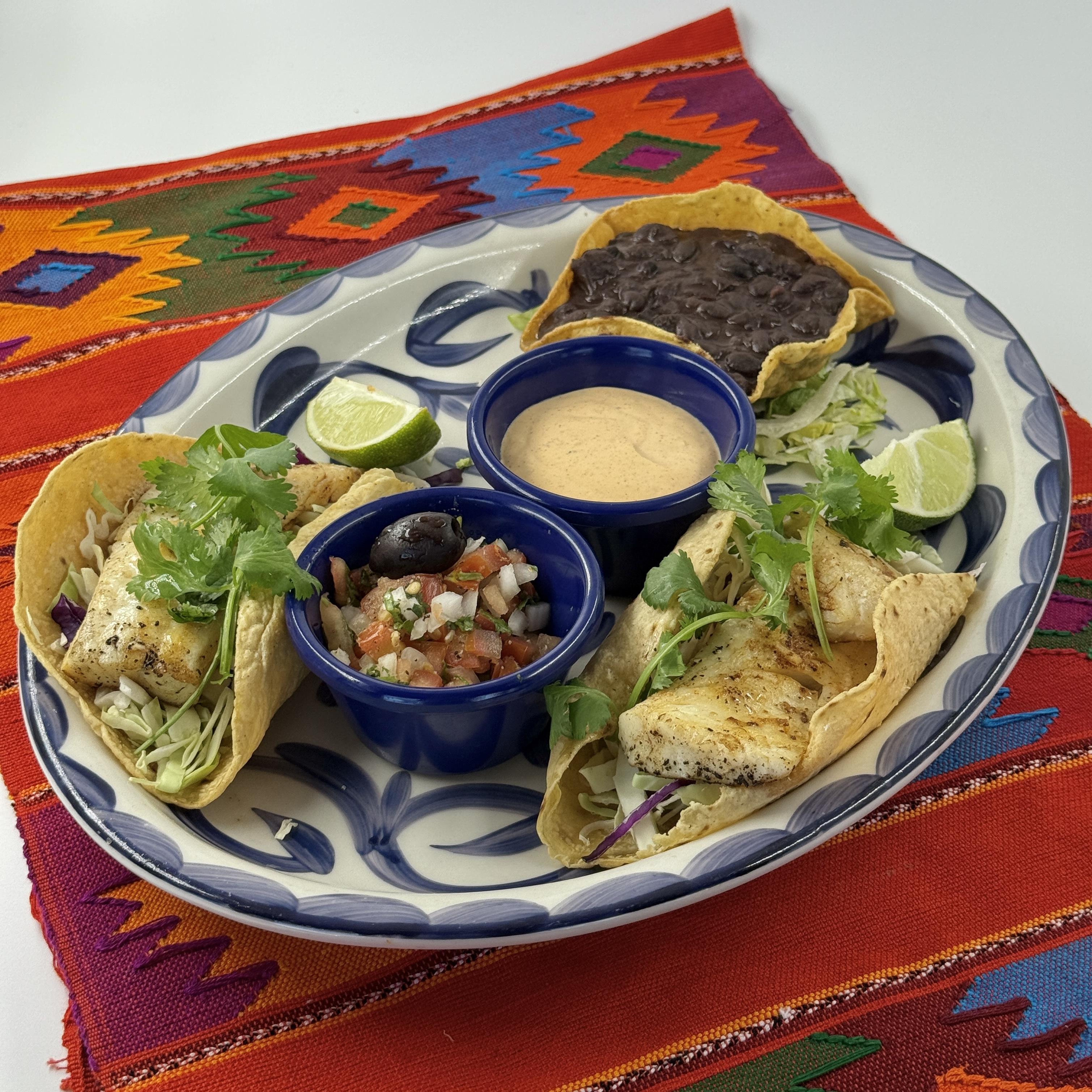 Muchisimos Taquitos, Traditional shredded beef or chicken rolled tacos topped with melted cheese. These taquitos are served with a side of zesty salsa, making them an irresistible favorite for everyone at the table.