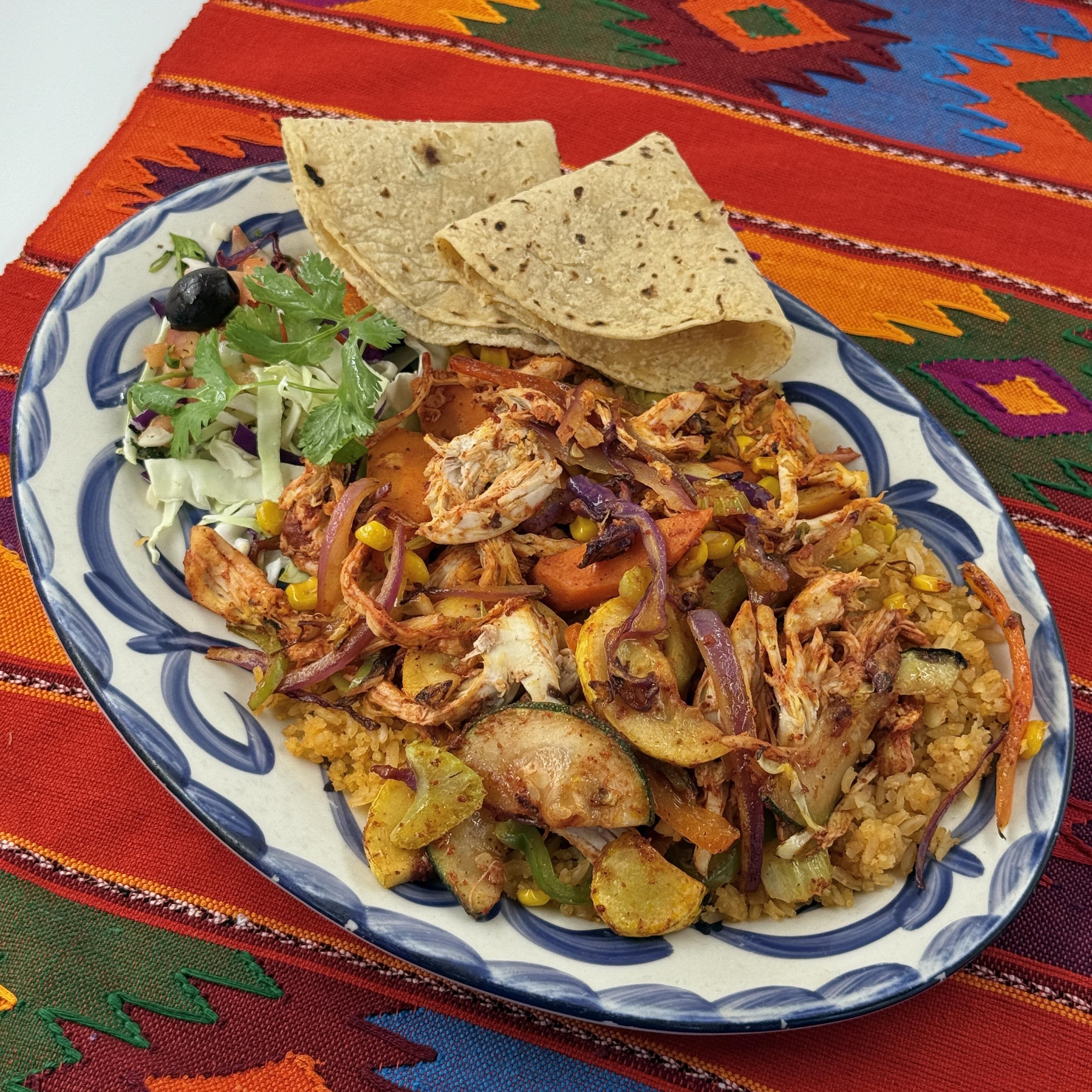 MEXICAN STIR FRY, Fresh vegetables sautéed with shredded chicken in our wonderful achiote sauce. Served over a bed of Mexican rice.