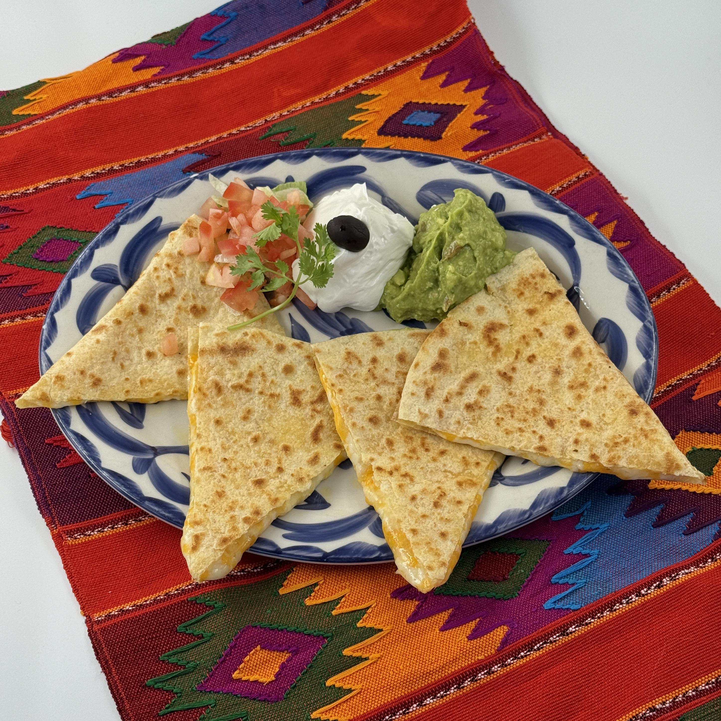 Pico Cheese Quesadilla at Casa de Pico La Mesa — warm flour tortillas filled with gooey melted cheese and Ortega green chiles served with fresh guacamole