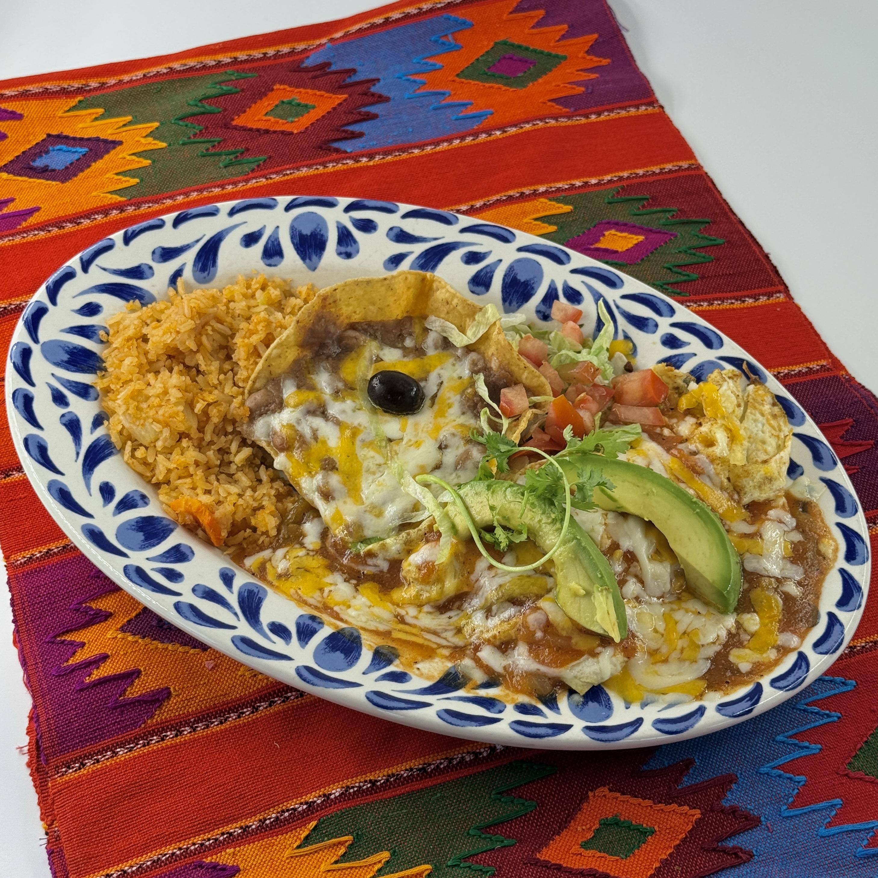 AVOCADO & GREEN CHILE OMELETTE A superb omelette filled with ortega chiles, avocado and cheese. Topped with savory espan˜ola sauce and served with rice and beans
