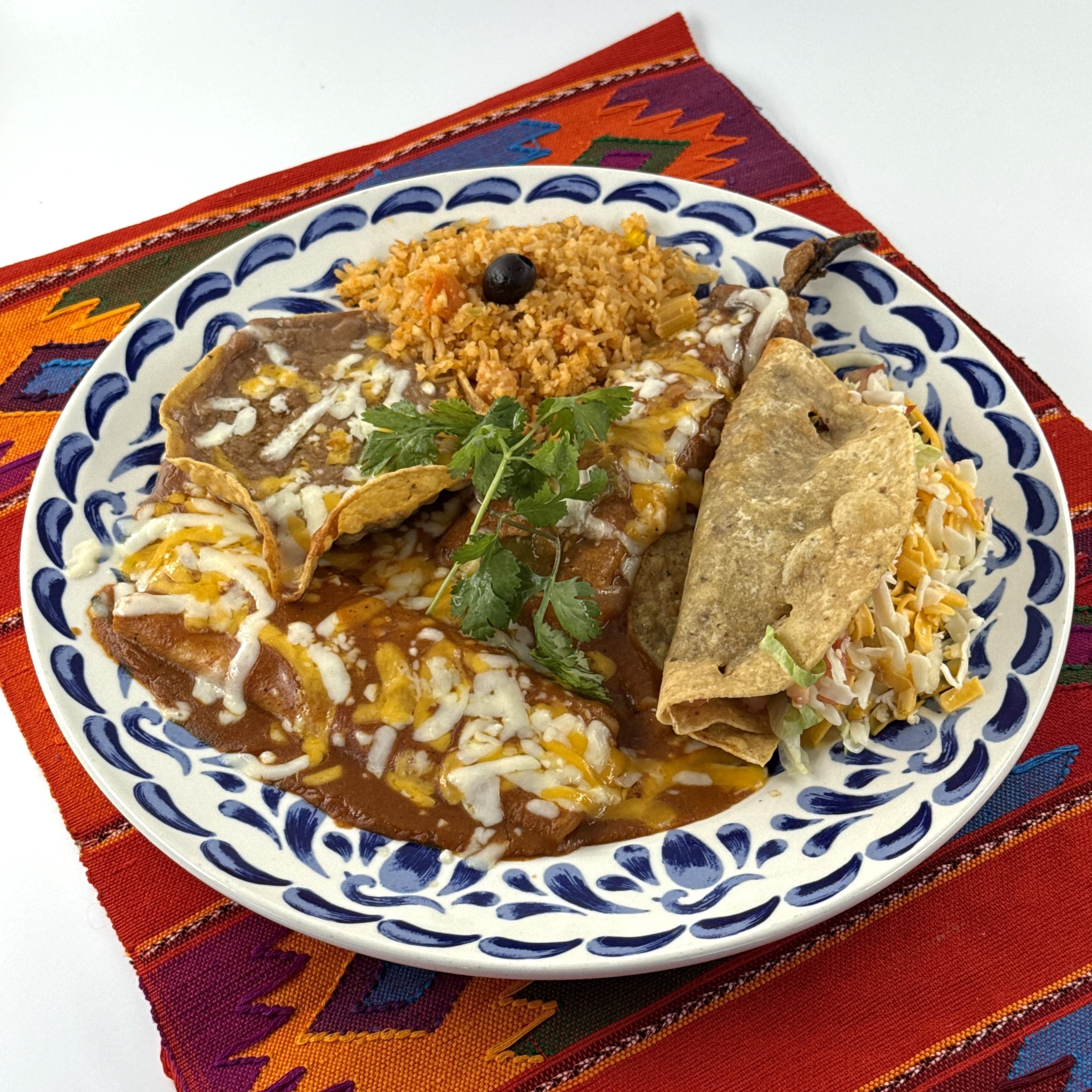 Casa de Pico El Bandido plate: beef taco, cheese enchilada & chile relleno with rice and beans