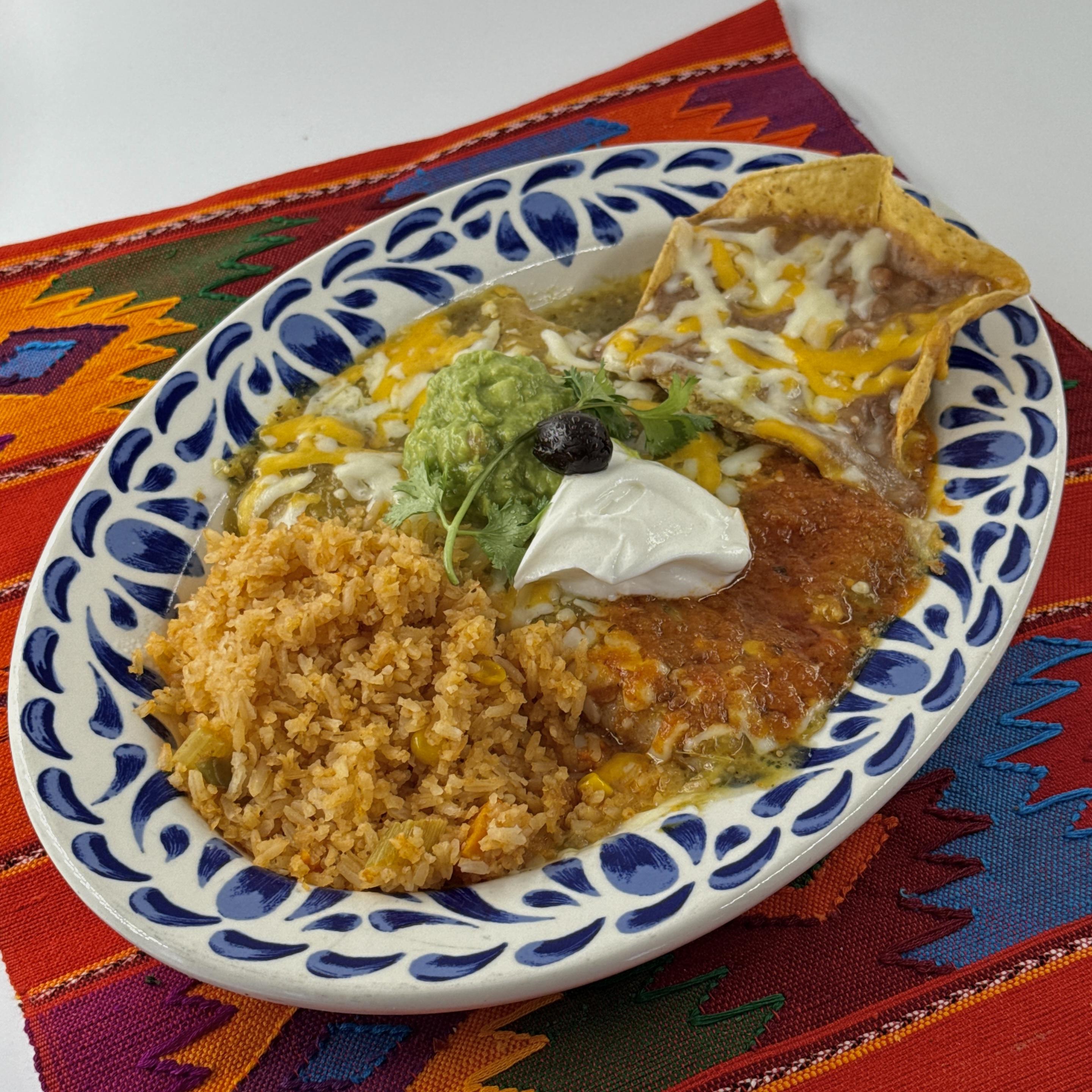 Casa de Pico enchiladas menu: Enchiladas Rancheras with red and green sauces, guacamole and sour cream, with rice and beans