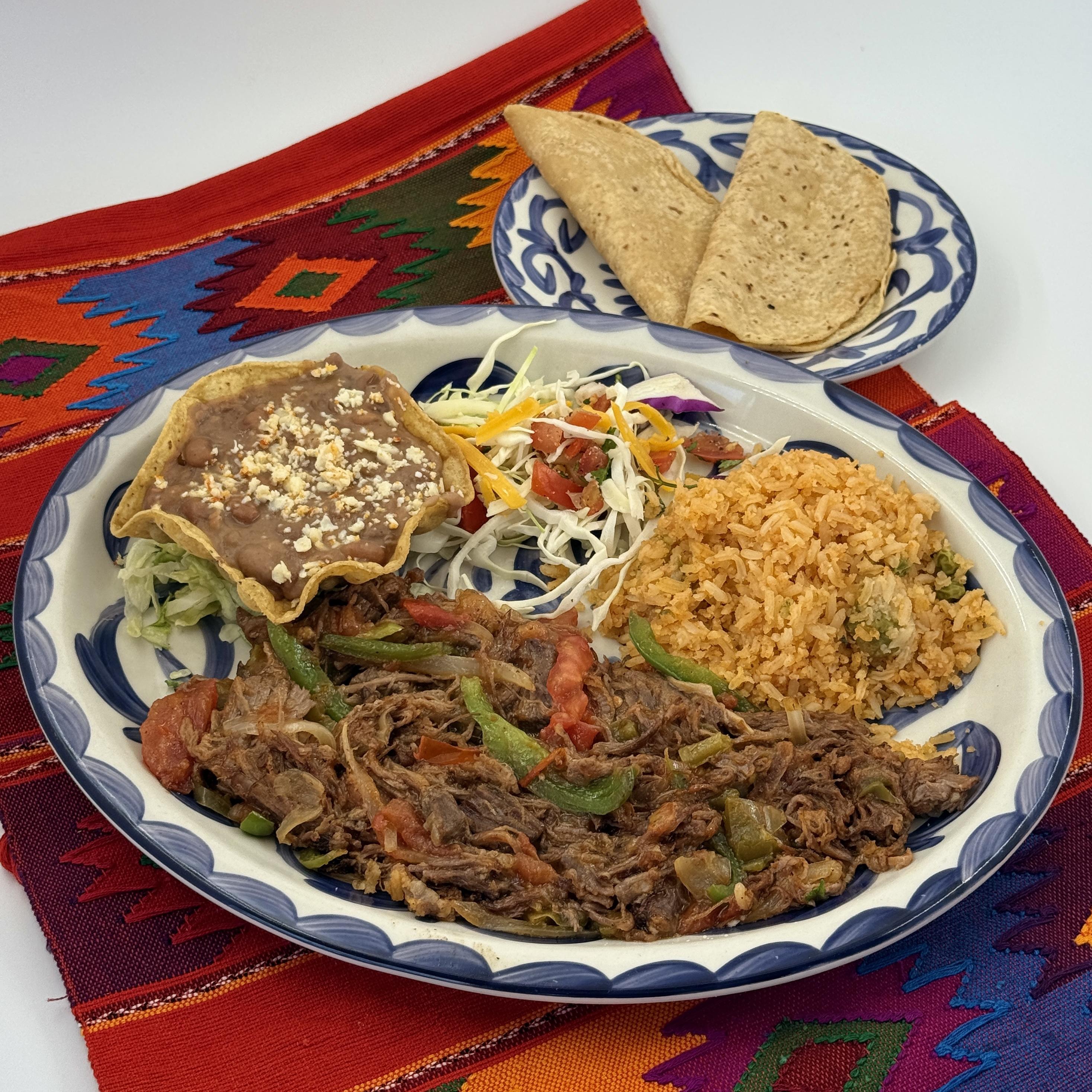 Casa de Pico ropa vieja with rice, refried beans and homemade tortillas