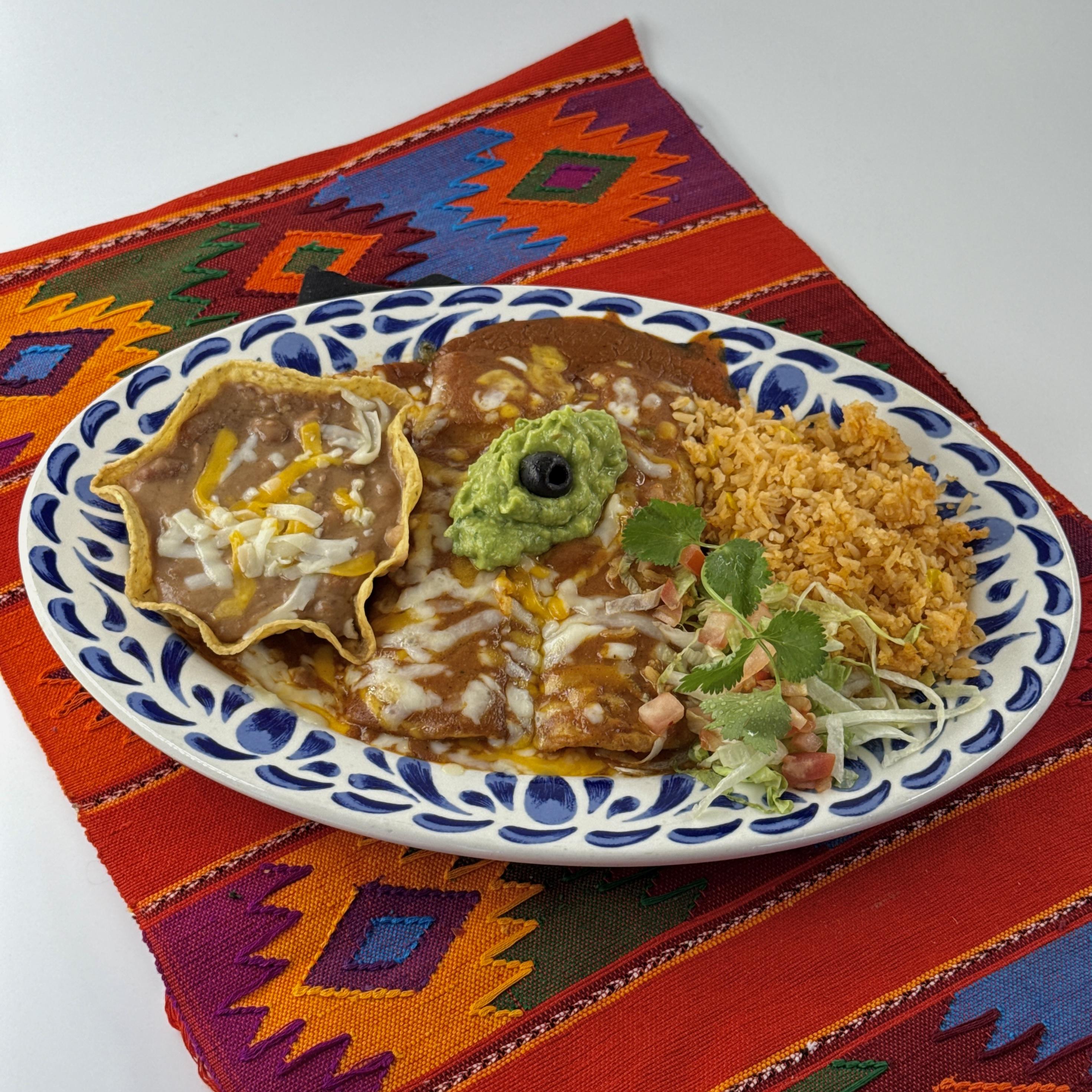Guacamole Enchiladas, Two guacamole enchiladas topped with jack and cheddar cheese and our famous enchilada sauce. Served with refried beans and Mexican rice. Add Beef or Chicken.