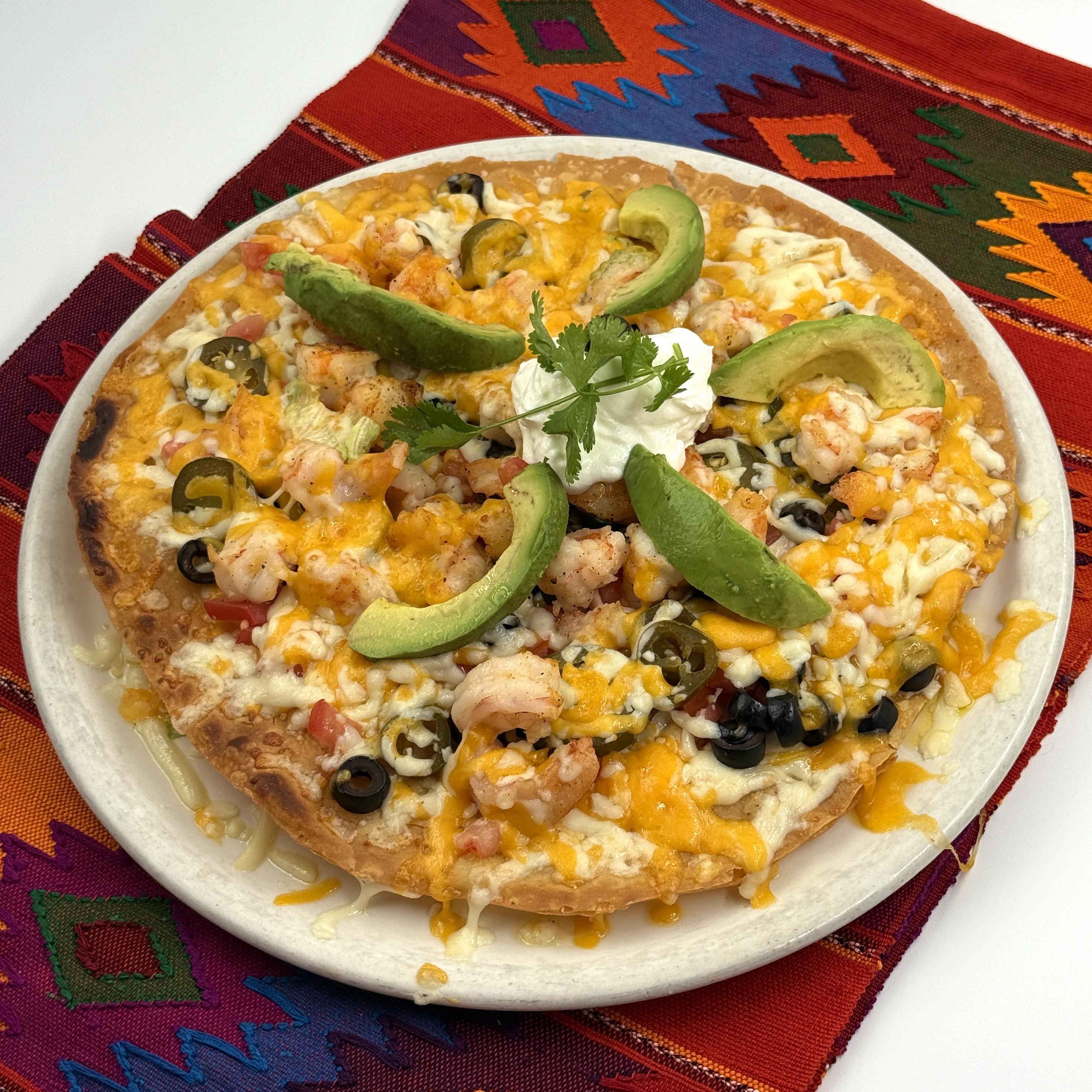 Muchisimos Taquitos, Traditional shredded beef or chicken rolled tacos topped with melted cheese. These taquitos are served with a side of zesty salsa, making them an irresistible favorite for everyone at the table.
