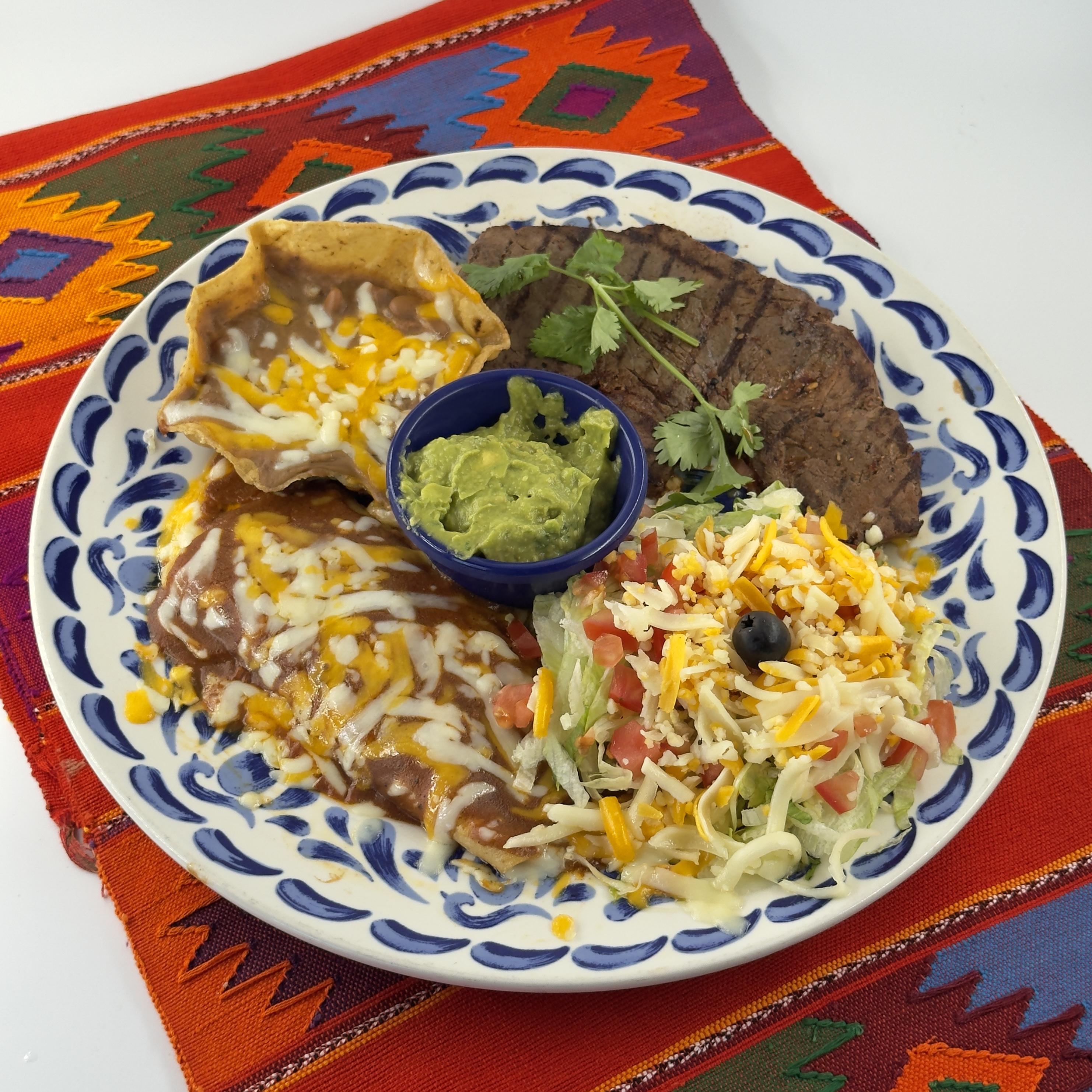 ¡CARNE ASADA! LA ESPECIAL DE JUAN Carne asada, a cheese enchilada, a Pico tostada, refried beans and guacamole.