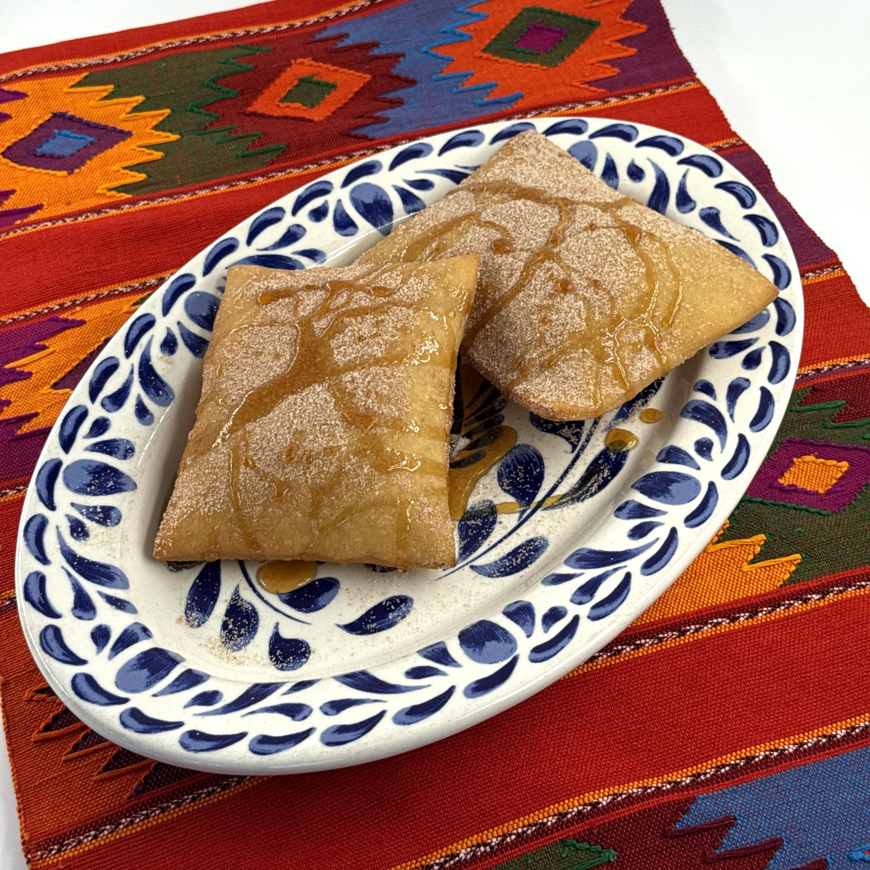 Sopapillas, Delicious pillows of lightly fried puff pastry served with honey.