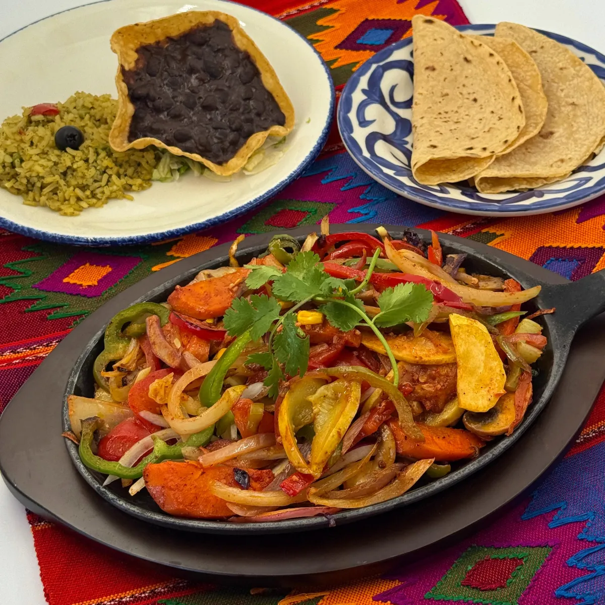 Casa de Pico vegetarian fiesta fajitas skillet with sautéed veggies, black beans, rice and warm tortillas