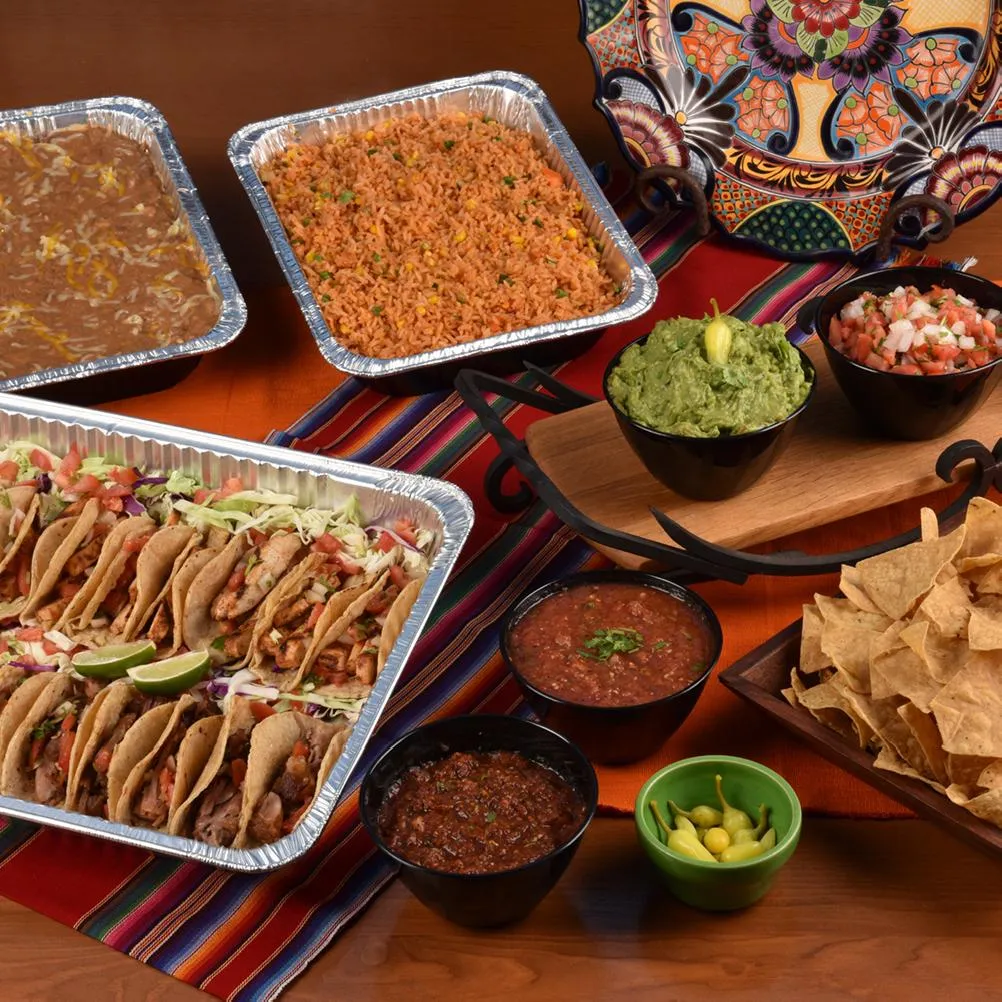 Family Fiesta Meals: party trays of tacos, rice, beans, chips and salsas