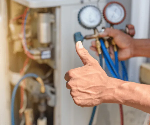 Homeowners discussing HVAC maintenance schedule with local technician