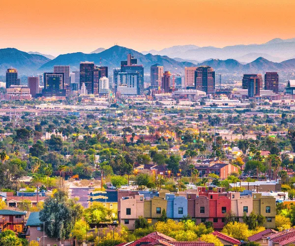 HVAC unit operating in hot Phoenix weather next to Arizona-style home
