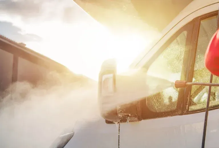 Technician performing interior and exterior RV detailing service on motorhome in St Charles Missouri