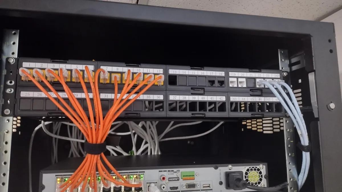 Cars driving on a highway under cloudy skies.