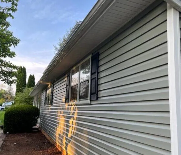 TEO Roofing professional installing high-quality siding for residential properties in Frederick, Maryland.